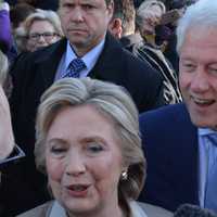 <p>Hillary and Bill Clinton walk by supporters and reporters in front of Douglas G. Grafflin Elementary School in Chappaqua after casting their presidential votes.</p>