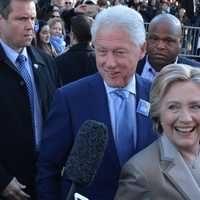 <p>Hillary and Bill Clinton walk by supporters and reporters in front of Douglas G. Grafflin Elementary School in Chappaqua after casting their presidential votes.</p>