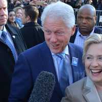 <p>Hillary and Bill Clinton walk by supporters and reporters in front of Douglas G. Grafflin Elementary School in Chappaqua after casting their presidential votes.</p>