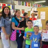 <p>Parents and their children participate in Neighbors Link Stamford&#x27;s Summer Reading Program</p>