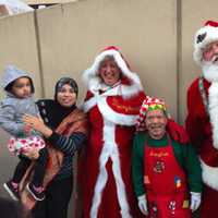 <p>Santa and Mrs. Claus along with a helper are always popular. They were at the inflation party for the UBS Parade Spectacular on Saturday evening.</p>