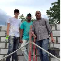 <p>From left, Danbury resident Colin Tate works with Kelvin and Jose (Director and Founder of CV) to  fill the blocks with cement.  Kelvin is mute and deaf but volunteers on every house.</p>