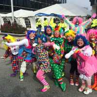 <p>While the wind drove the large balloons away, nothing can keep clowns away from the UBS Parade Spectacular on Sunday.</p>