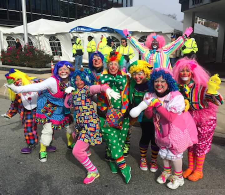 While the wind drove the large balloons away, nothing can keep clowns away from the UBS Parade Spectacular on Sunday.