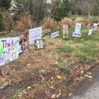 <p>Hillary Clinton&#x27;s neighbors on Old House Lane in Chappaqua posted lawn signs thanking her for running for president.</p>