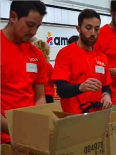 Volunteers Assemble First Aid Kits To Help Americares Help The World