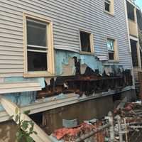 <p>Damage due to a fire at 40 Lockwood Ave., can be seen at the side of the house. Six people were displaced and two firefighters slightly injured. The cause is under investigation.</p>