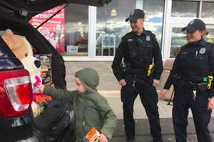 Kids Pitch In As Norwalk Police Stuff A Cruiser With Gifts At Toys 'R' Us