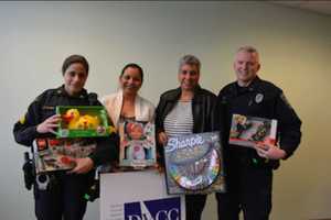 Norwalk Police Deliver Gifts To Domestic Violence Center
