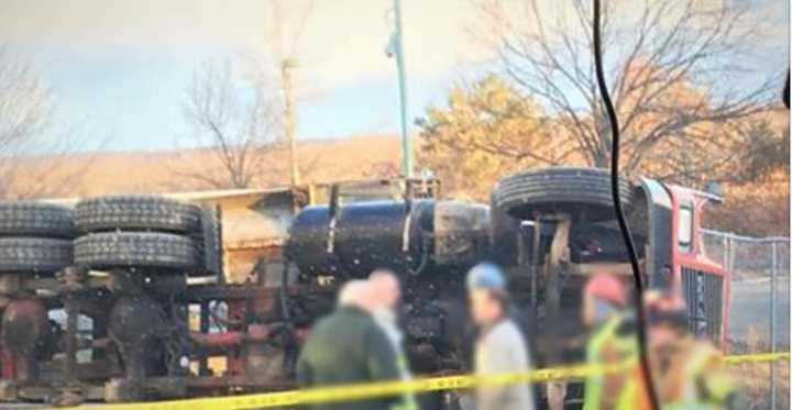 Firefighters respond to a tractor-trailer rollover in Shelton on Thursday.