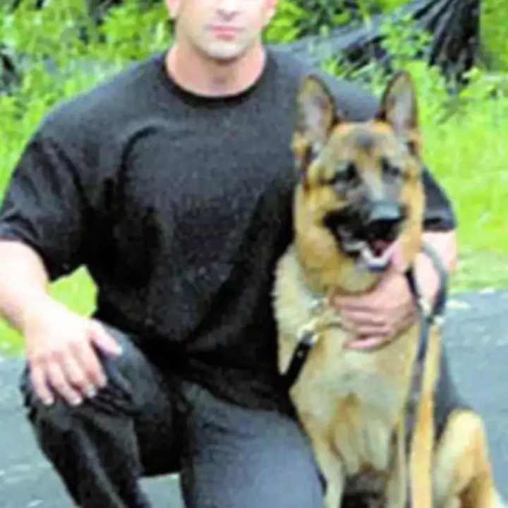 Nicholas Tartaglione with a K-9 officer in 2007 when Tartaglione was a member of the Briarcliff Manor Police Department.