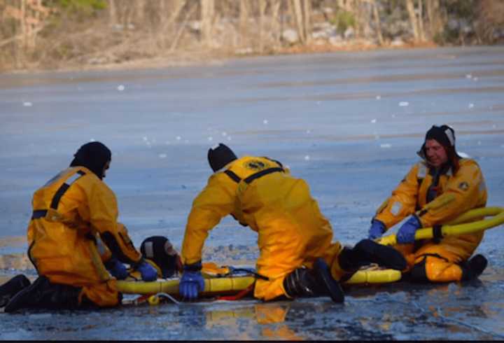 Greenwich firefighters practicing ice rescue.