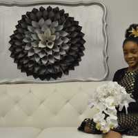 <p>12-year-old Ziya Shabazz-Williams of Danbury has her own business, called &quot;Ziya Blooms,&quot; which sells custom-made hair accessories, wall art, pens and wedding bouquets -- all of which she makes by hand.</p>