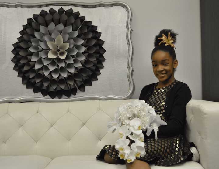 12-year-old Ziya Shabazz-Williams of Danbury has her own business, called &quot;Ziya Blooms,&quot; which sells custom-made hair accessories, wall art, pens and wedding bouquets -- all of which she makes by hand.