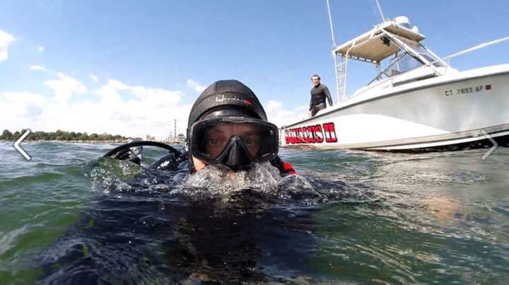 Denis Habza of Squalus Marine goes for a dive.