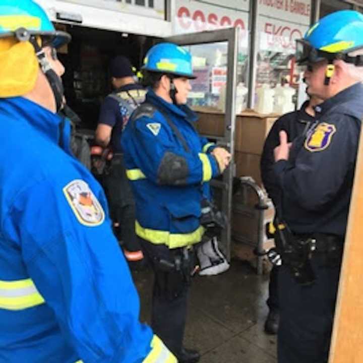 Emergency responders at the scene of the roof collapse at National Wholesale Liquidators on Central Avenue.