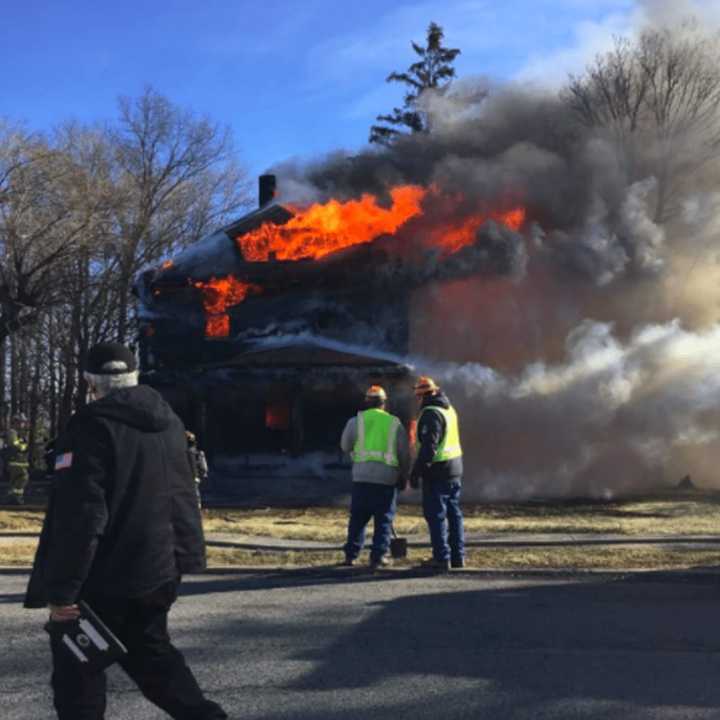 A home at 18 Slinn Ave. in Spring Valley is fully engulfed in flames.