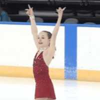 <p>Emilia Murdock of Darien takes her bows before receiving her silver medal in the Intermediate Ladies competition of the U.S. Figure Skating Association on Sunday in Kansas City, Mo.</p>