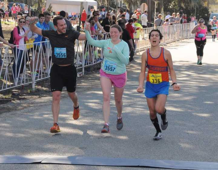 Ryan Fox, right, of Danbury finished second in Saturday&#x27;s Charleston Marathon in South Carolina. Runners on the left are finishing the half marathon.