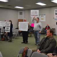 <p>Members of Save Our Shelton held up signs and advanced on the Planning &amp; Zoning Commission during a Thursday meeting.</p>