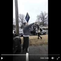 <p>A man holding a Trump sign yells at Danbury High students as they leave school on Jan. 20.</p>