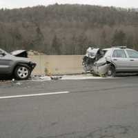 <p>A motorist allegedly slammed into a parked State Police vehicle on Route 7 in Brookfield Monday morning. The driver and trooper were taken to hospital with undetermined injuries.</p>