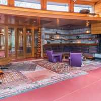 <p>The home features soaring glass walls and allows lots of natural light.</p>