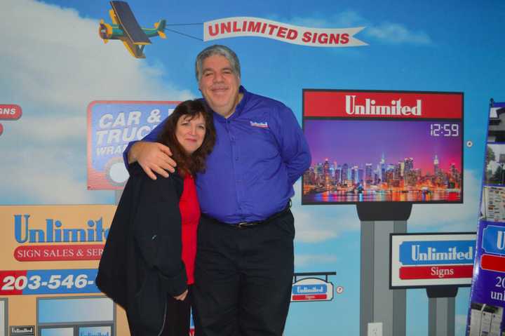 New Fairfield couple Mike and Marian Goldstein at their newly expanded Brookfield sign business, Unlimited Signs, Designs &amp; Graphics.