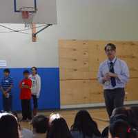 <p>Jon Neuhausel, STEM theme coach at the Westside Middle School Academy in Danbury, speaks to the audience about the space program.</p>