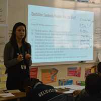 <p>A teacher in training works with a seventh-grade class at Great Oaks Charter School in Bridgeport.</p>