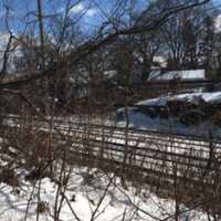 <p>A fallen tree is down on the Metro-North wires on Monday near 120 Hendrie Ave. in Old Greenwich. The problem closed one track and caused delays for much of the afternoon, but it has been cleared in time for afternoon rush hour.</p>