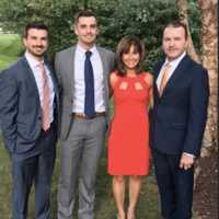 <p>P.J. Mannion, far left, with his wife Kathy and their two sons, Chris and Brad</p>