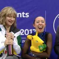 <p>Redding&#x27;s Brooklee Han, center, celebrates with coaches Darlene and Peter Cain after her free skate at the Four Continent Championships.</p>