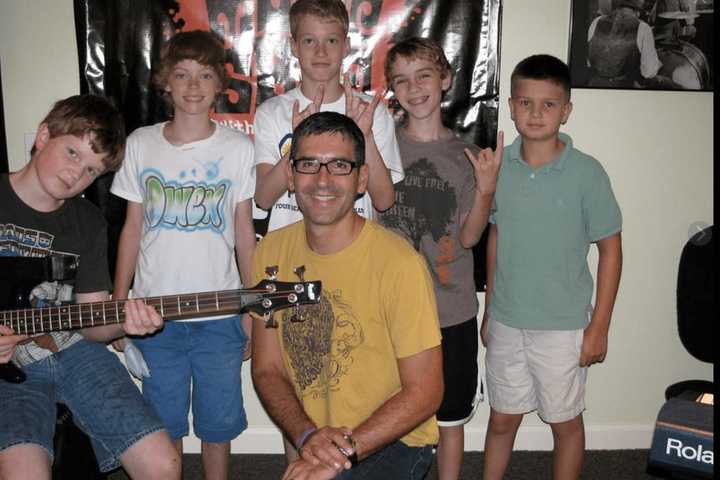 David Morgan (front and center), owner and founder of the Music Shed in Redding, surrounded by his students