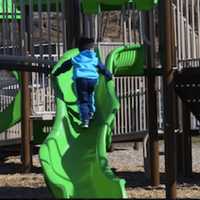 <p>Kids play at Rogers Park in Danbury on Friday afternoon.</p>