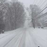 <p>Snow-covered Route 35 in Yorktown from Ridge Street in the early afternoon Tuesday.</p>