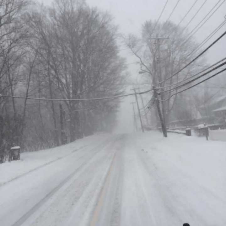 Snow-covered Route 35 in Yorktown from Ridge Street in the early afternoon Tuesday.