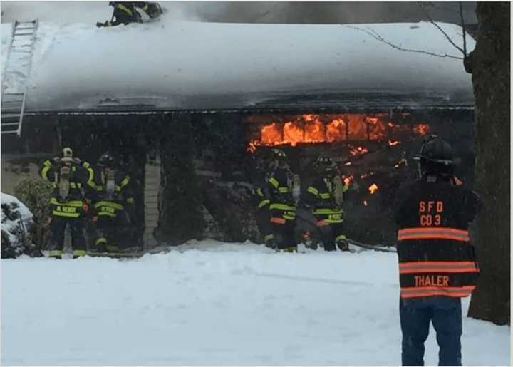 Three New Rochelle firefighters were injured while battling a fire on Thornbury Road on Tuesday.