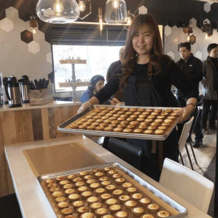 Seonah bringing out our fresh baked cream cheese honey tarts at Mavi&#x27;s Coffee and Patersserie in Fort Lee.