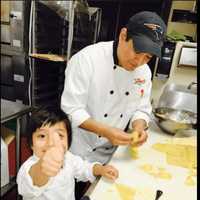 <p>Julliano&#x27;s Authentic Italian Cuisine in Bethel will celebrate its one year anniversary on Sunday.  From left, Julliano Cevallos, 4, and his father, owner Julio Cevallos</p>