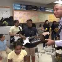 <p>Former New York Yankee Bernie Williams jams with students at Jettie S. Tisdale School in Bridgeport during a segment on NBC Nightly News.</p>