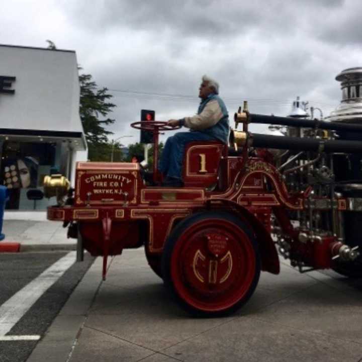 Jay Leno hit the town on an old-school Wayne firetruck.