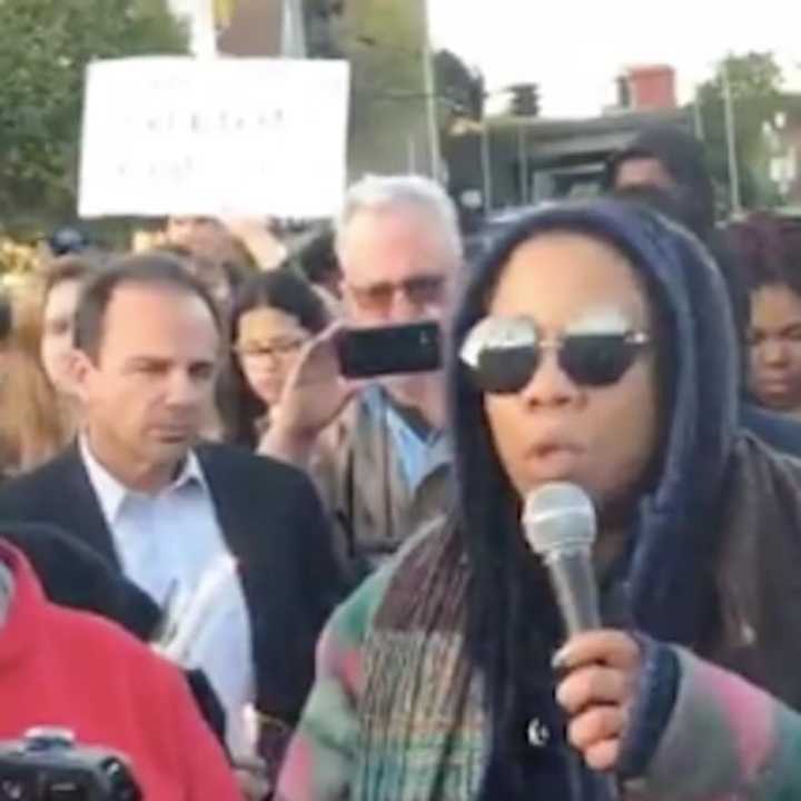 Mayor Joe Ganim is in the crowd at a vigil Wednesday evening in Bridgeport, behind a protester speaking to a Facebook Live audience.