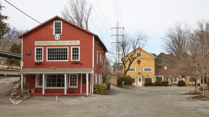 The red building that houses the Cannondale Holistic Center is part of Cannondale Village, which is listed for $6.85 million.