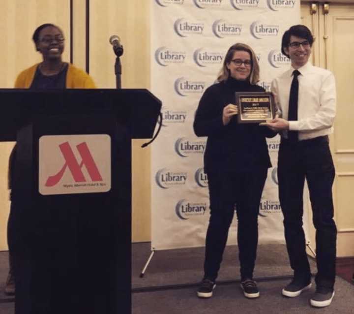 Beth Grimes, second from right, and Christopher Bacchiocchi, far right, won a state award for their innovative #MeetUp program at Stratford Public Library.