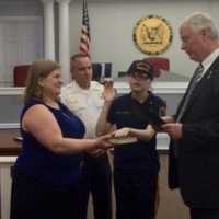 <p>Fair Lawn Mayor John Cosgrove swears in &quot;Chief for a Day&quot; Natalia, with her mom and Chief Glen Cauwels.</p>