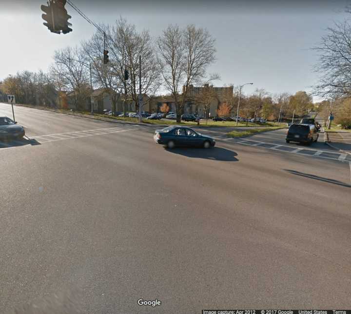 A woman on a bike was hit by a car that fled the area.