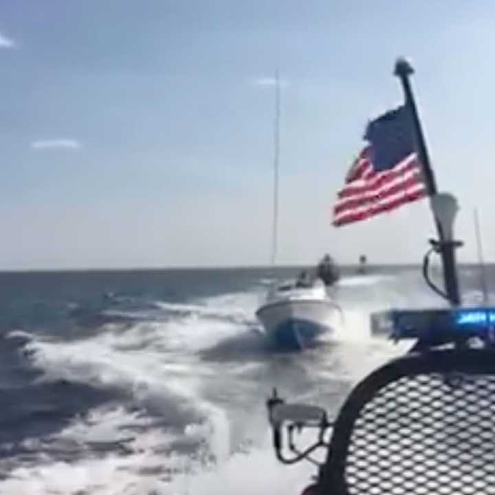 The Westport Police Marine Unit assists Fairfield police with a boater who went overboard past the Penfield Reef Lighthouse on Sunday. The victim suffered a large cut on his arm.