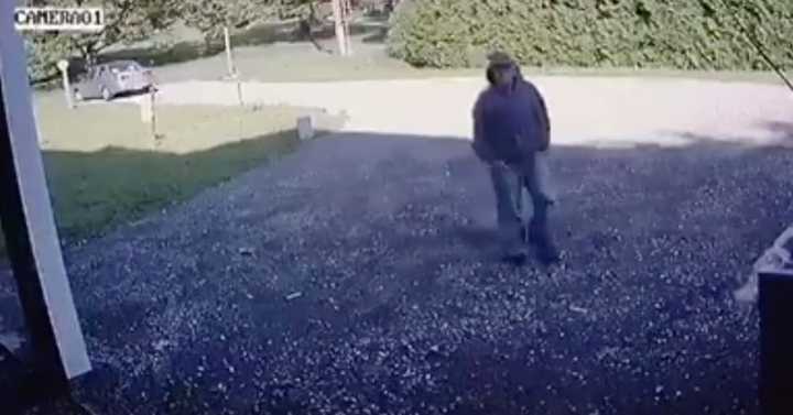 The suspect in a Trumbull burglary on Sunday — an unknown male wearing blue jeans, a gray-colored hooded sweatshirt, and a baseball hat — was captured on home surveillance before cutting the wires.