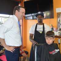 <p>U.S. Sen. Chris Murphy dropped in at North East Barbershop in Bridgeport on free back-to-school haircut day Thursday.</p>